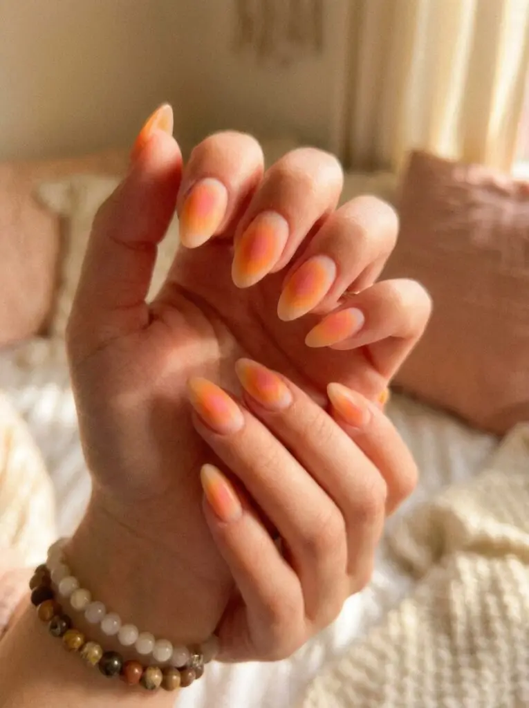 Orange aura nail art trend.