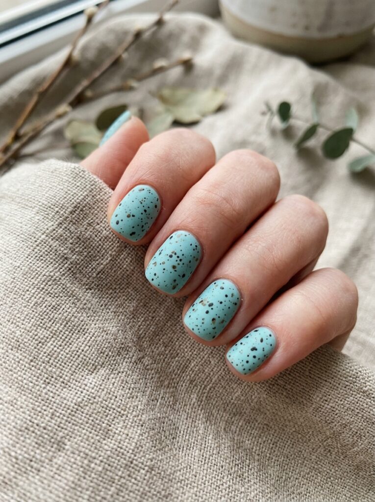 Pastel rainbow nails decorated with realistic 3D gel water droplets.